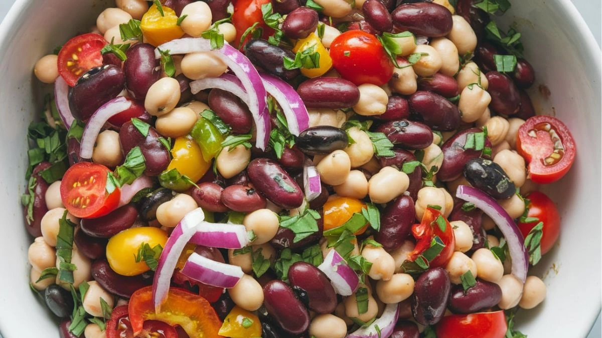 Delicious 7-bean salad with fresh vegetables and herbs, a protein-packed meal perfect for lunch or dinner – easy and healthy recipe.