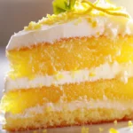 Lemon cake slice with frosting on a plate